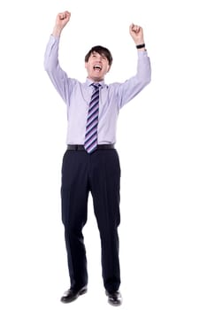 Successful businessman raising his arms up