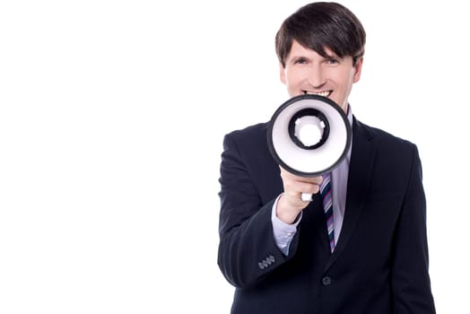 Businessman using megaphone to make an announcement
