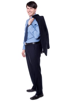 Businessman holding his coat over his shoulder in full length pose.