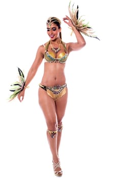 Hispanic woman dancing samba and posing to camera.