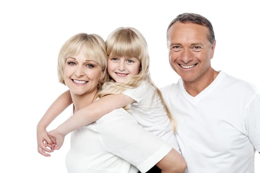 Joyful family of three posing to camera