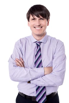 Elegant middle aged businessman posing with crossed arms.
