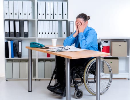 disabled business man in wheelchair is depressed