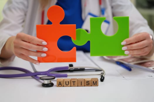A dedicated healthcare professional shines a light on autism awareness through the use of colorful puzzle pieces