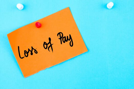 Loss Of Pay written on orange paper note pinned on cork board with white thumbtack, copy space available