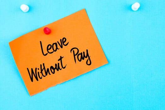 Leave Without Pay written on orange paper note pinned on cork board with white thumbtack, copy space available