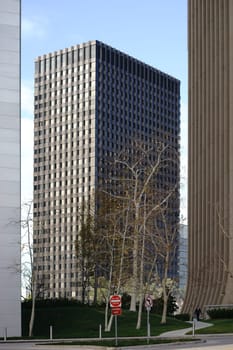 Los Angeles,United States - December 27,2015: A passerby walks between different skyscrapers along a path in the city center on December 27,2015 in Los Angeles.