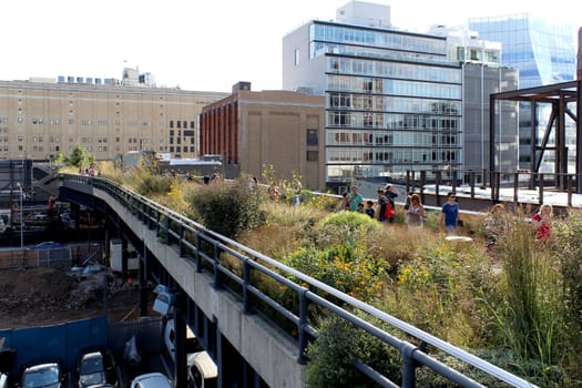 NEW YORK CITY - SEPTEMBER 03: People at High Line Park in NYC on September 03th, 2013. The High Line is a public park built on an historic freight rail line elevated above the streets on Manhattan West Side.