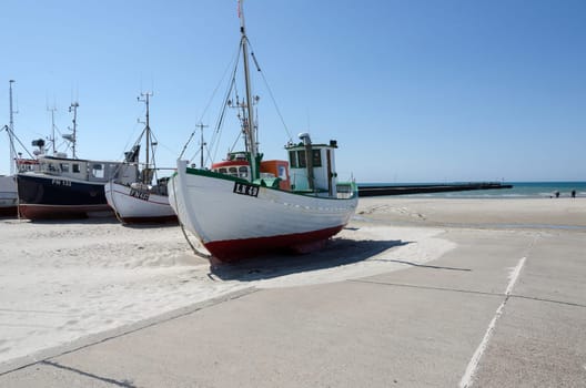 A few fishingboat on land waiting for fish