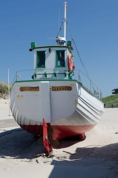 Lonely fishingboat on land in Denmark