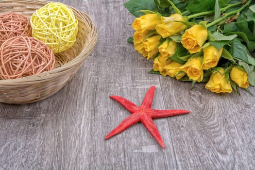 Red starfishes and orange yellow on a wooden background