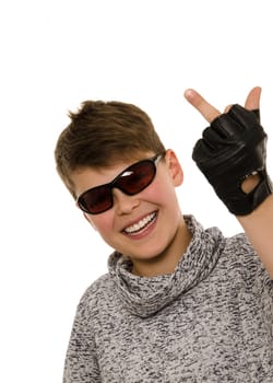 Cheeky boy with an unkind gesture on a white background
