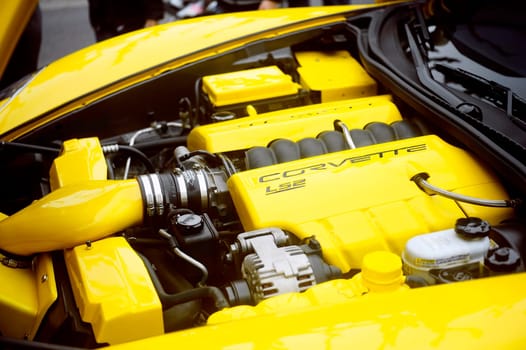 A yellow corvette exposed to a gathering of American motorcycles in Beaucaire in the French department of Gard