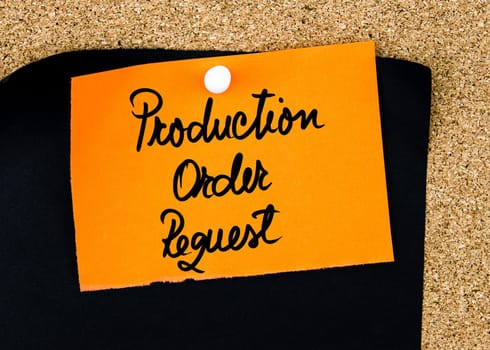 Production Order Request written on orange paper note pinned on cork board with white thumbtacks, copy space available