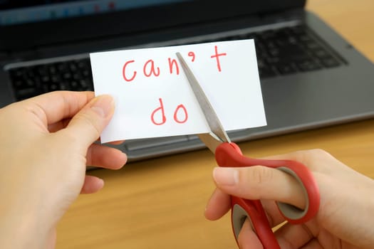 holds card with text can't do on computer