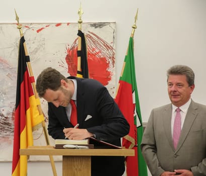 Prince Georg Friedrich of Prussia (great-great-grandson of Kaiser Wilhelm II) enters the guest book of the state capital Magdeburg at the reception by the Mayor Dr. Lutz Trümper (independent) on 22 May 2016