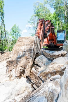Excavator with big shovel to work with rocks