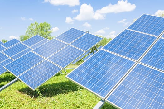 Solar panels placed on a countryside meadow.