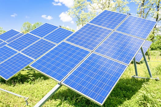 Solar panels placed on a countryside meadow.