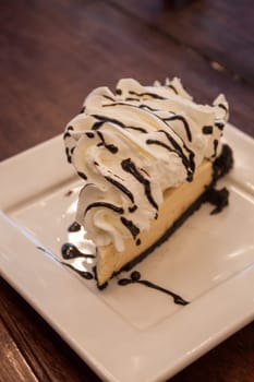 Piece of cake on white plate, stock photo