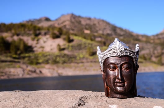 One Ancient Buddha Statue Near The Ocean