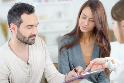 couple signing form