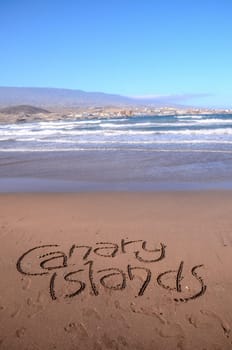 Word Written on the Sand of a Tropical beach