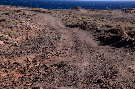 Long Straight Dirt Desert Road disappears into the Horizon.