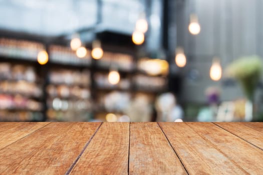 Perspective wood and blurred cafe background. product display template
