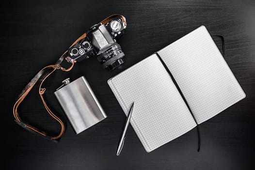 Retro Camera With Notebook On Dark Background