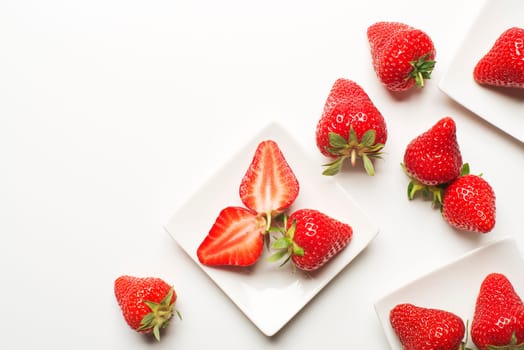 Fresh red strawberry on a white background close up.