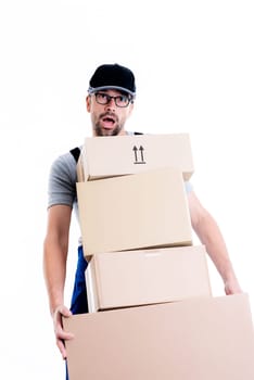 overstrained postman with parcels in front of white background