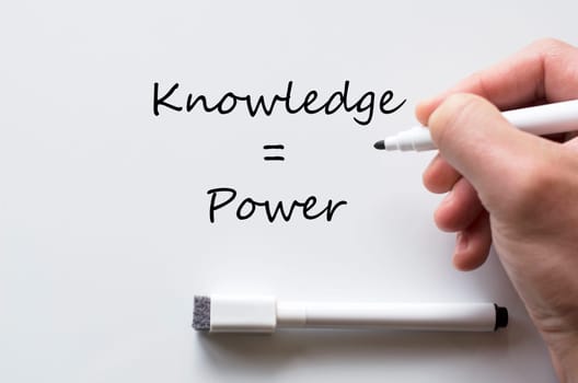 Human hand writing knowledge and power on whiteboard