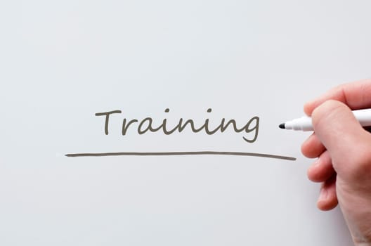 Human hand writing training on whiteboard