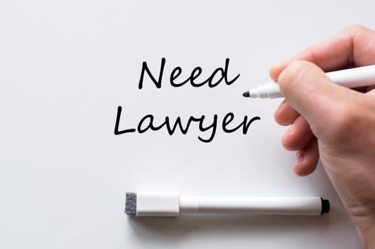 Human hand writing need lawyer on whiteboard