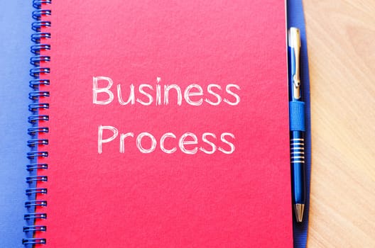 Business process text concept write on notebook
