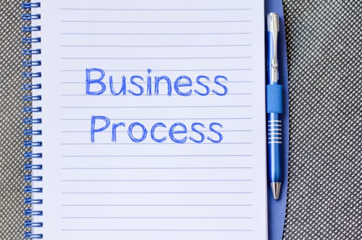 Business process text concept write on notebook