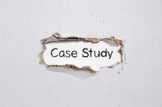The word case study appearing behind torn paper.