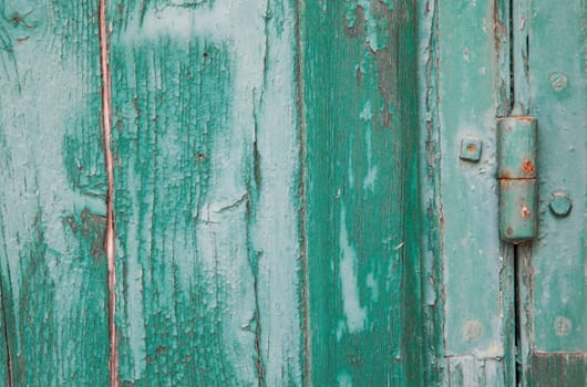 Grunge old wood panels ruined by weather with hinge