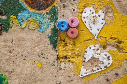 Hand painted wall with  bottle plugs and plastic made hearts