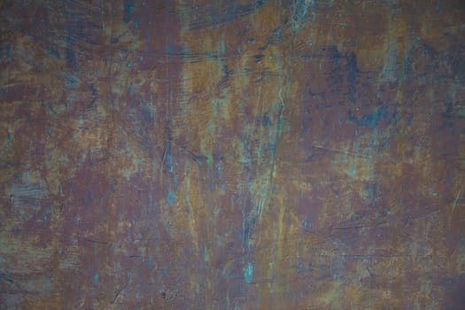 A old wall scratched in multi colors way