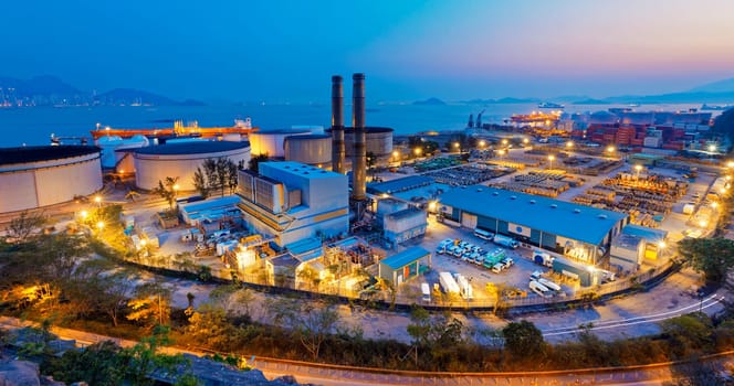 petrochemical industry on sunset , hong kong coal power station and oil tank