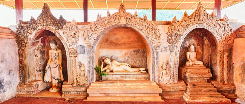 Three Buddha statues at Takhaung Mwetaw pagoda in Sankar. Myanmar.