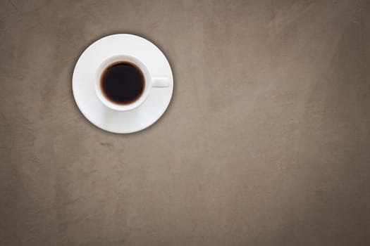 Top view of coffee cup on gray concrete texture background