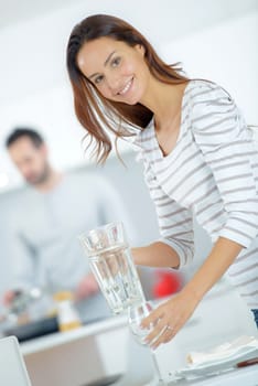 Woman setting the dining table