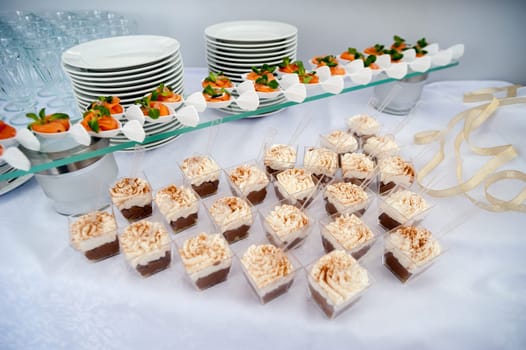 beautiful candy bar serving a festive table with cupcakes towers and sweet love sign