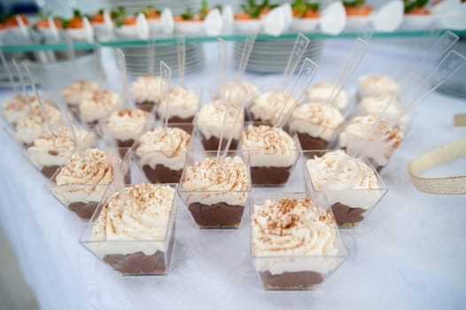 beautiful candy bar serving a festive table with cupcakes towers and sweet love sign