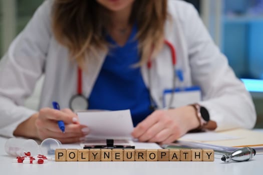 A qualified healthcare professional meticulously reviews notes on polyneuropathy within a clinical environment