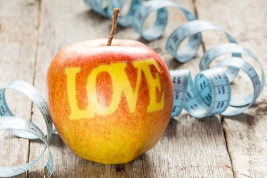 Apples with the word LOVE, symbol of health and nutrition