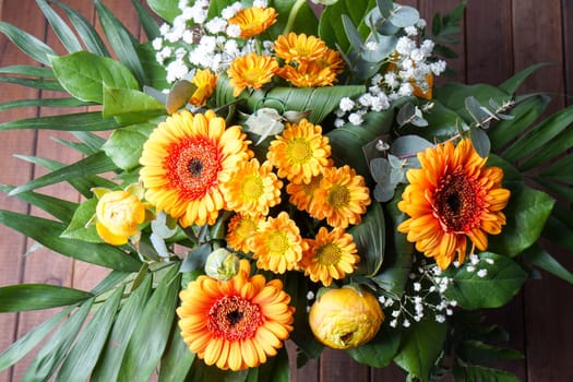 bouquet of orange flowers, perfect for Mothers day or birthdays. Peonies, Bridal Viels, green leaves and daisies